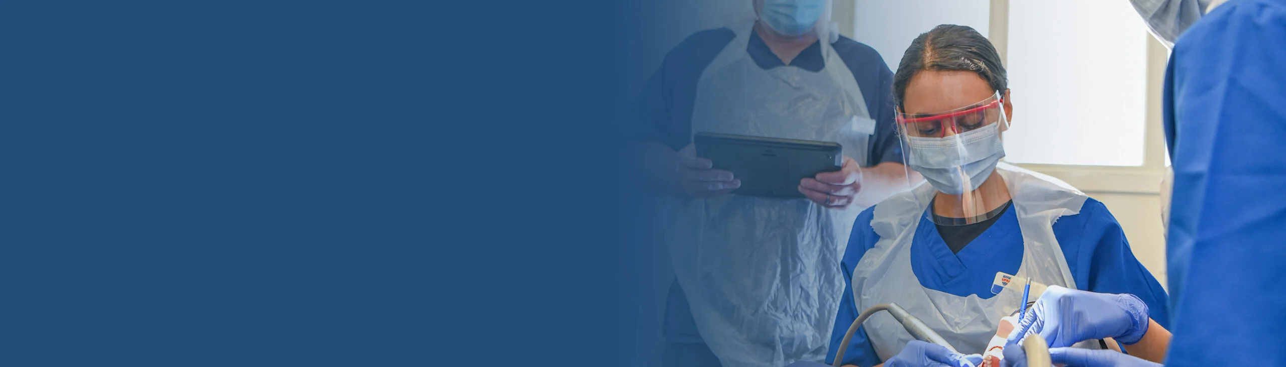 Student on clinic working on patient